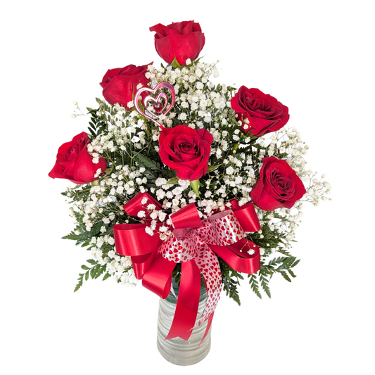 Half a dozen roses in a vase